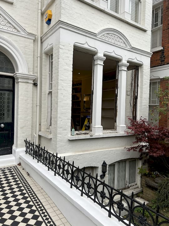 Craftsman examining period door glazing styles